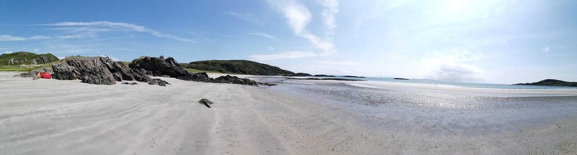 Silver sand of Ardalanish Bay with blue skies above