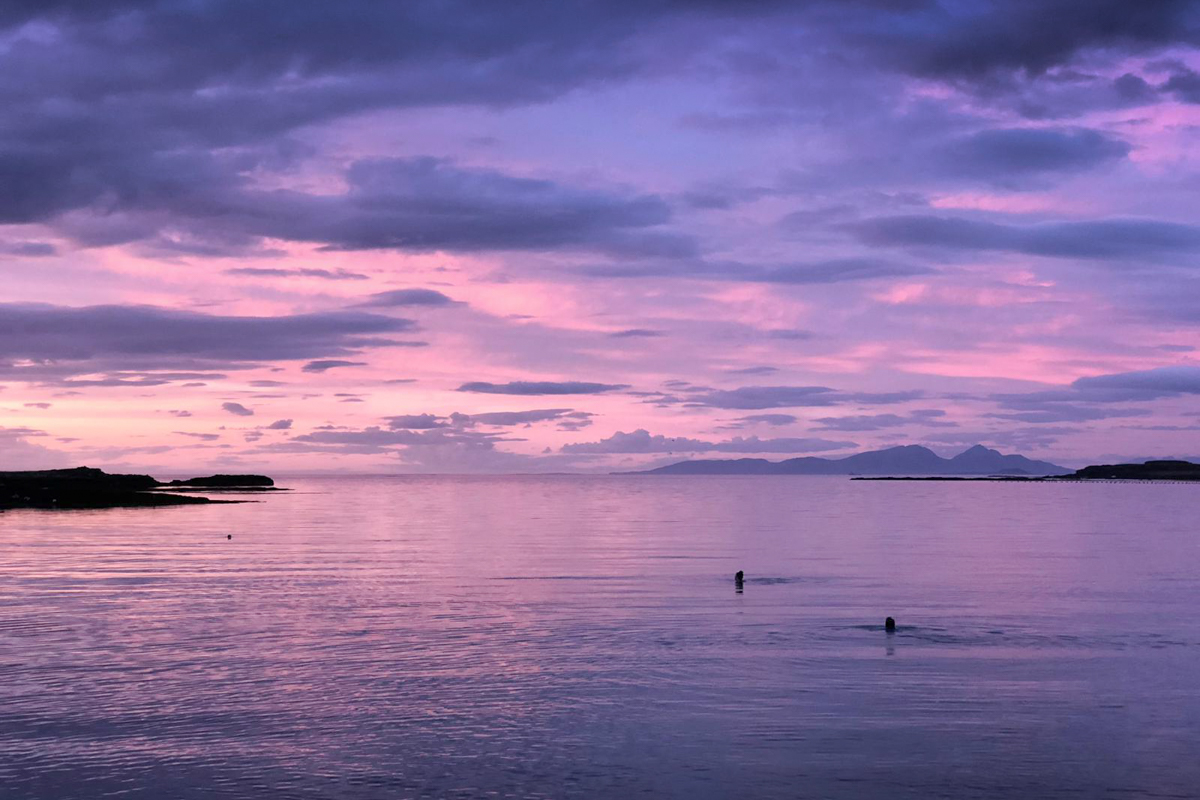 Wild swimming on Mull in the bays around Croig at sunset