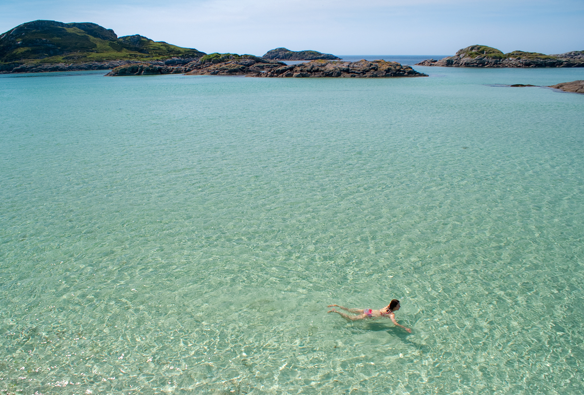 Swimming in clear turquoise waters at Knockvologan on the Ross of Mull