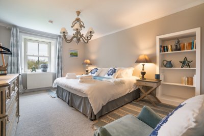 The ground floor double bedroom promises elegance, with private garden views