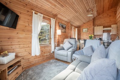 Open-plan living at Fors Lodge cabin with living, dining and kitchen together