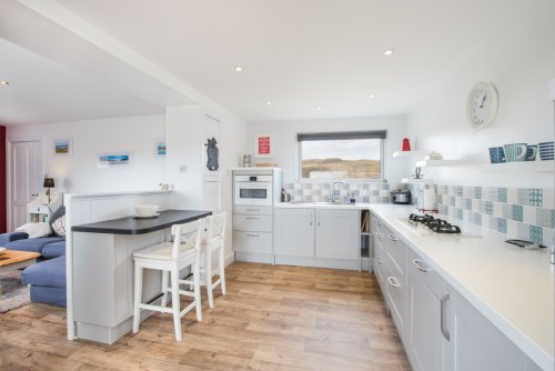 Guests will appreciate the contemporary and well-equipped kitchen, which makes self-catering simple from this cottage's remote location