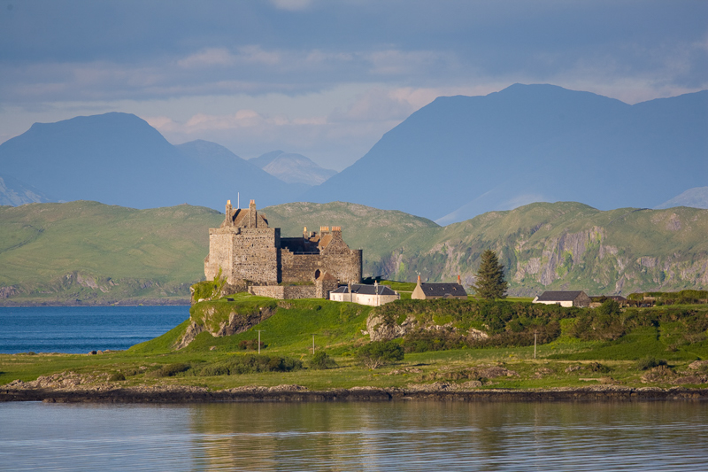 Duart Castle standing proudly on an outcrop in south east Mull, seen from the ferry as it approaches Craignure