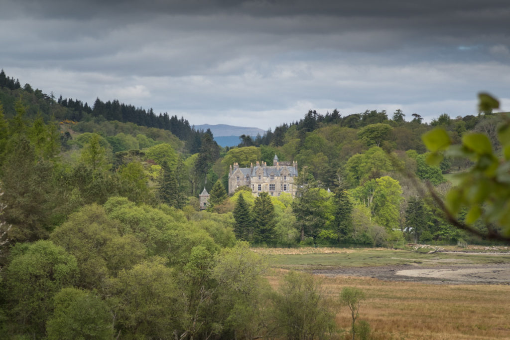 View to Torosay Castle surrounded by trees on the Isle of Mull