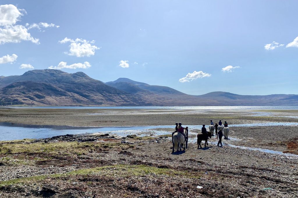 pony trekking along the beach Isle of Mull