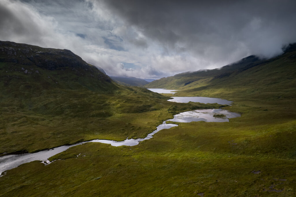 River feeding chain of three lochs in Glen More