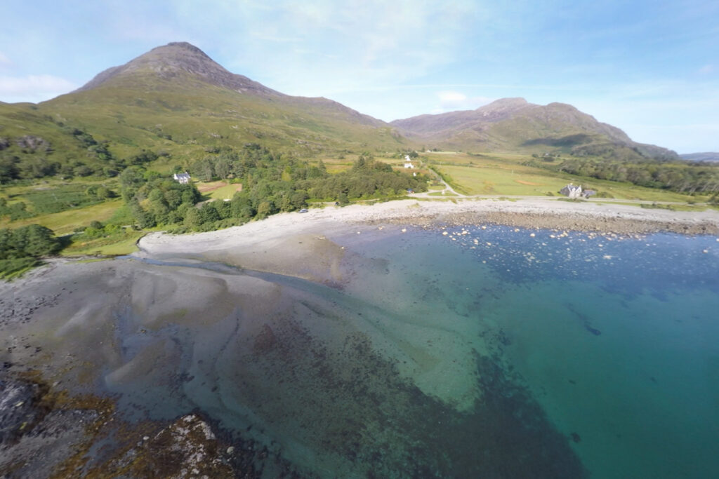 Coastal view of Loch Buie with mountains behind the sea shore