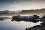 Wrecked boats beside the road provide a point of interest and place to stop