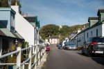 Narrow street of Dervaig with its village shop and residents houses