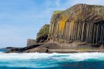 Staffa with the three rock layers; tuff bottom, columnar basalt middle and volcanic debris on top