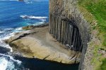 A figure lends a sense of scale to Staffa