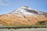 A snow capped Ben Buie as seen from the beach at Laggan Sands