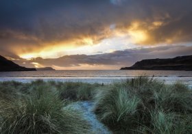 Walking to the shore at Cargary beach during sunset