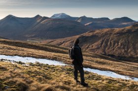 A walker surveys the mountains of Mull's interior