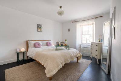 The spacious master bedroom with a king-sized bed