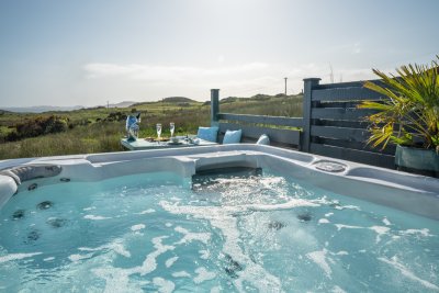 Pamper yourselves with a soak in the massage hot tub