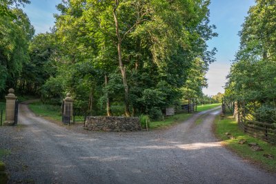 The driveway to Mucmara Lodge, with the gates to the Quinish Estate on the left