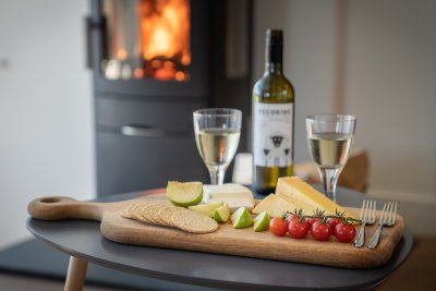Enjoy a glass of wine and relax in front of the stove at Mor Aoibhneas 