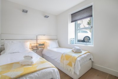 The twin bedroom on the ground floor is light and bright