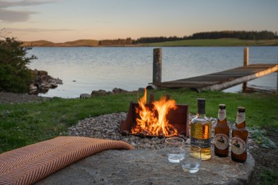 Gather around the cosy firepit and enjoy sundowners by the loch