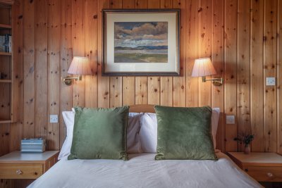 Beautifully appointed bedrooms promise a great night's sleep under dark skies
