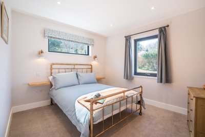 The second double bedroom at the cottage which too enjoys a glimpse of the sea