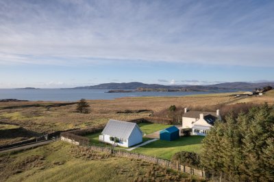 Balmeanach Farmhouse enjoys a private position within extensive gardens with a superb sea view