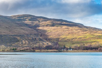 Enjoy glorious views back to Butterfly Cottage as you walk around the bay