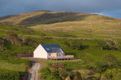 A gravel track leads up from the road to Caber Feidh