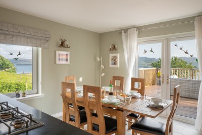 Dining space for six with inviting french doors out to the terrace