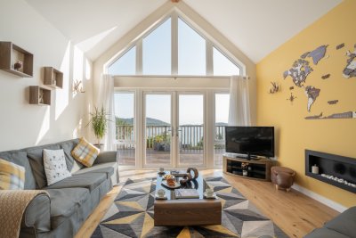 Natural light fills the living space with views out to Loch Tuath and beyond
