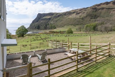 The lovely landscaped sitting area with views over the beach and sea