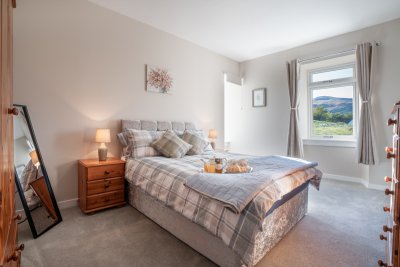 The master bedroom is filled with natural light