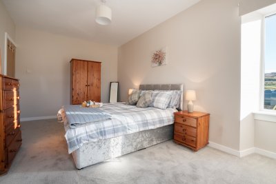 Another view of the spacious master double bedroom, with ample space to stow belongings
