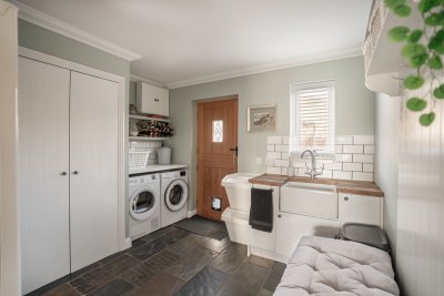 The handy utility leads off the kitchen