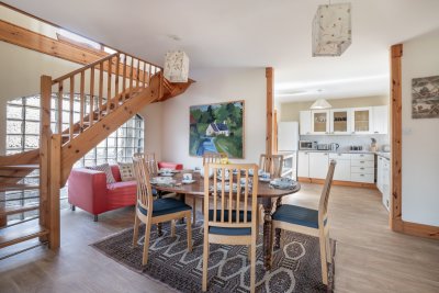 An open-plan flow from the kitchen to the dining area