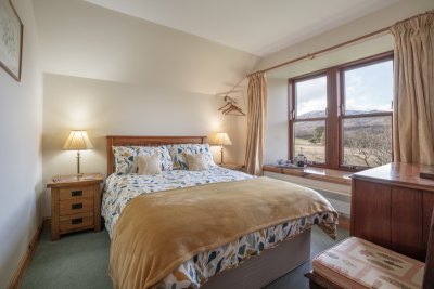 One of three inviting bedrooms