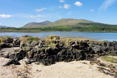 Discover sandy wee beaches at low tide near Duart