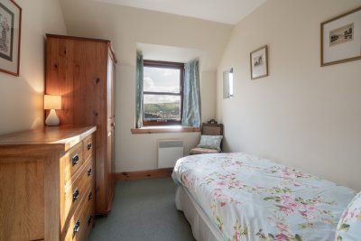 The cosy single bedroom offers flexible accommodation for groups
