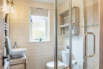 Well-appointed shower room with ocean-inspired decor