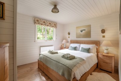 Awake to beautiful views over gardens and orchard to the hills beyond