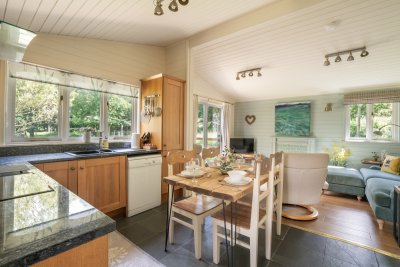 Looking across the open plan kitchen, dining and living space at the cabin