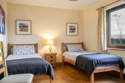 The cosy twin bedroom features fantastic local artworks
