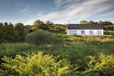 The cottage sits in a nicely elevated plot looking out to sea