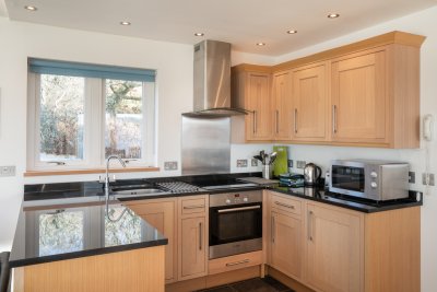 The open plan kitchen layout means the chef is never far from the action