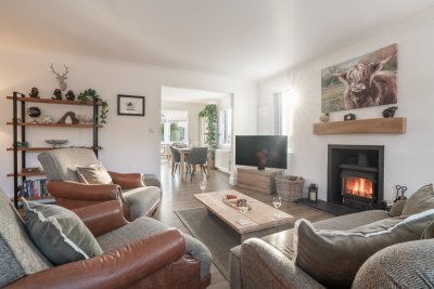 The living area feels cosy, but flows effortlessly to the dining kitchen too