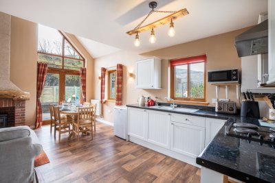The kitchen, dining and living area spans the ground floor of the cottage