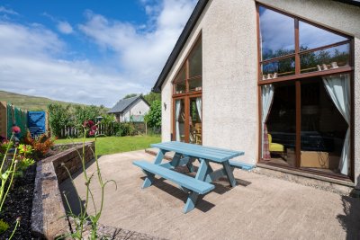 The cottage enjoys a private, fenced patio area and small garden