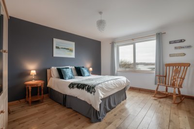 The spacious, ground-floor, king-sized double with superb sea views