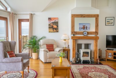 Comfortable seating by the fire in the living space 